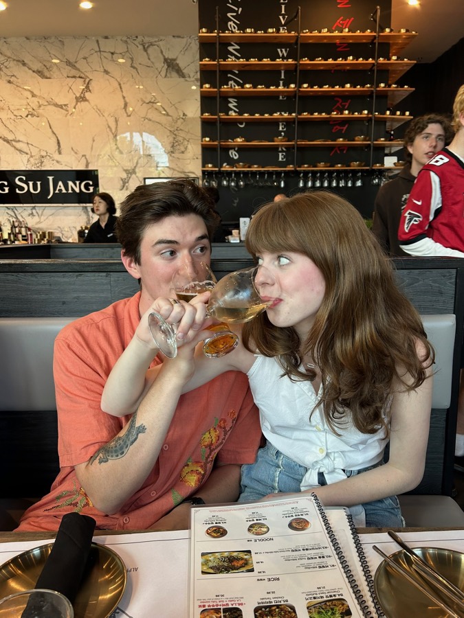 Elizabeth and Nicholas raising a drink together in Atlanta.