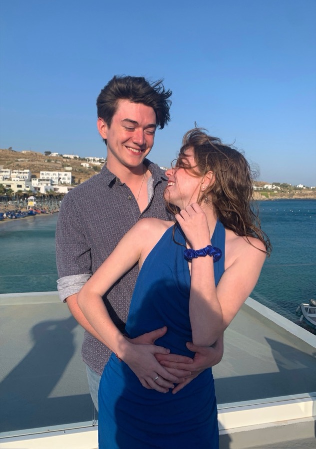 Elizabeth and Nicholas in Greece with the wind blowing off the water.