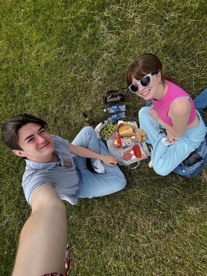 Elizabeth and Nicholas at a picnic on the grass in Oxford.