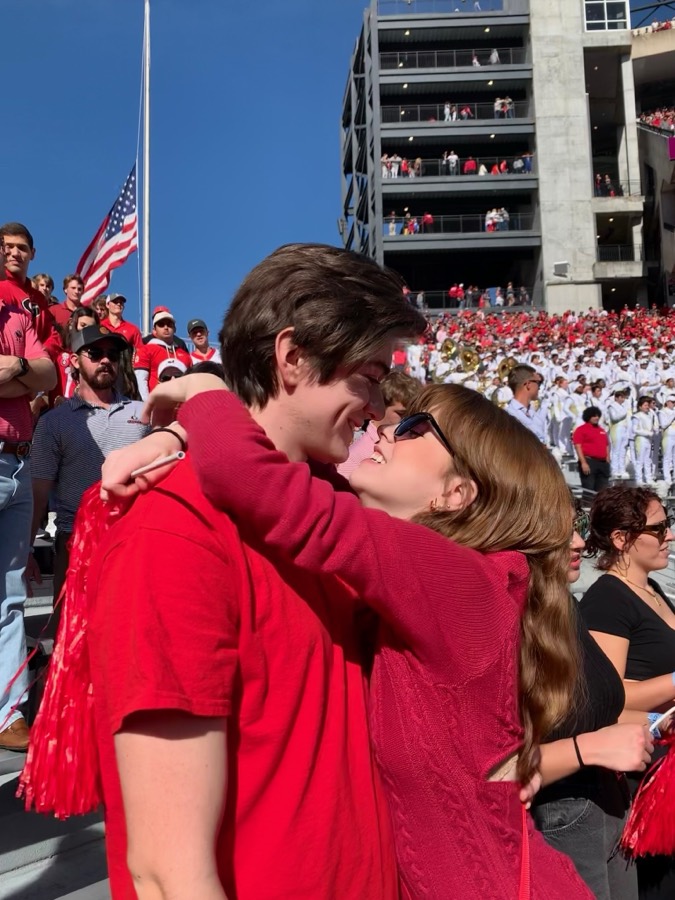 Elizabeth and Nicholas in the stands at Sanford Stadium on a football Saturday.